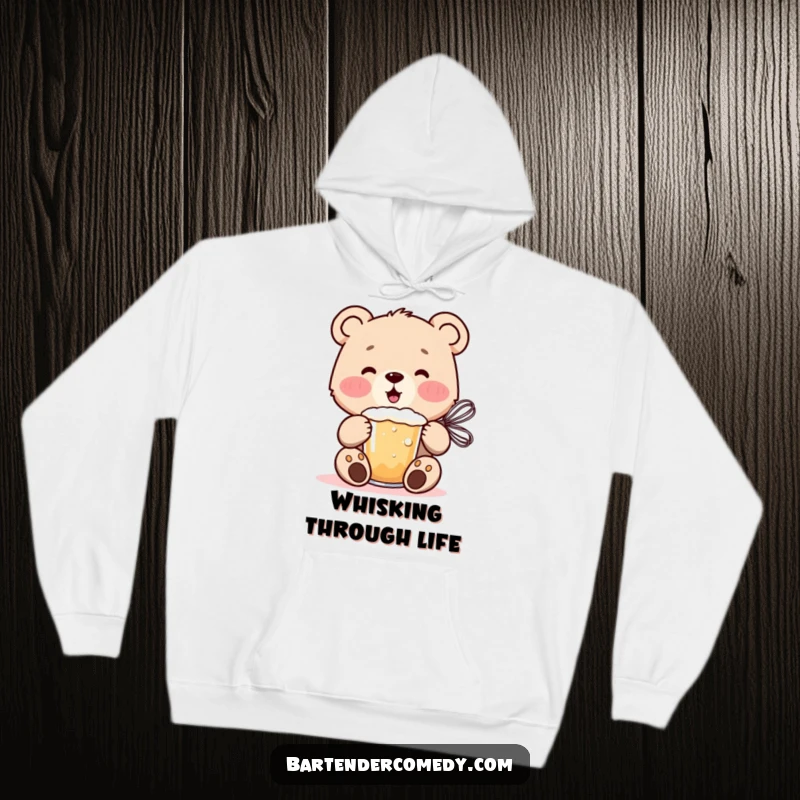Funny cheerful bear cub mixing a frothy drink with a whisk, featured on a cozy and warm hoodie.