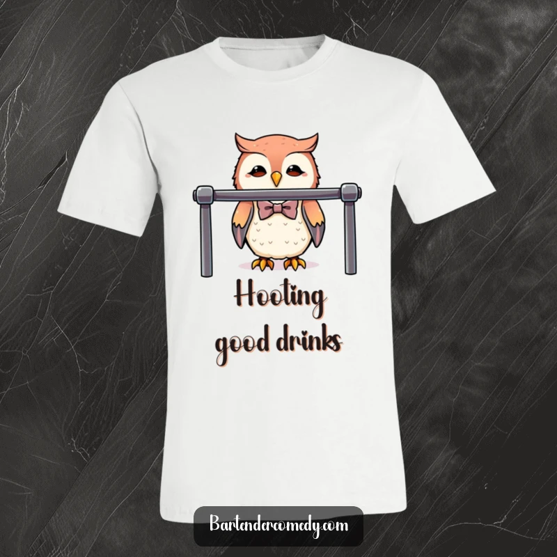 A cute owl dressed in a tiny bowtie stands behind a polished bar on this funny bartender t-shirt.